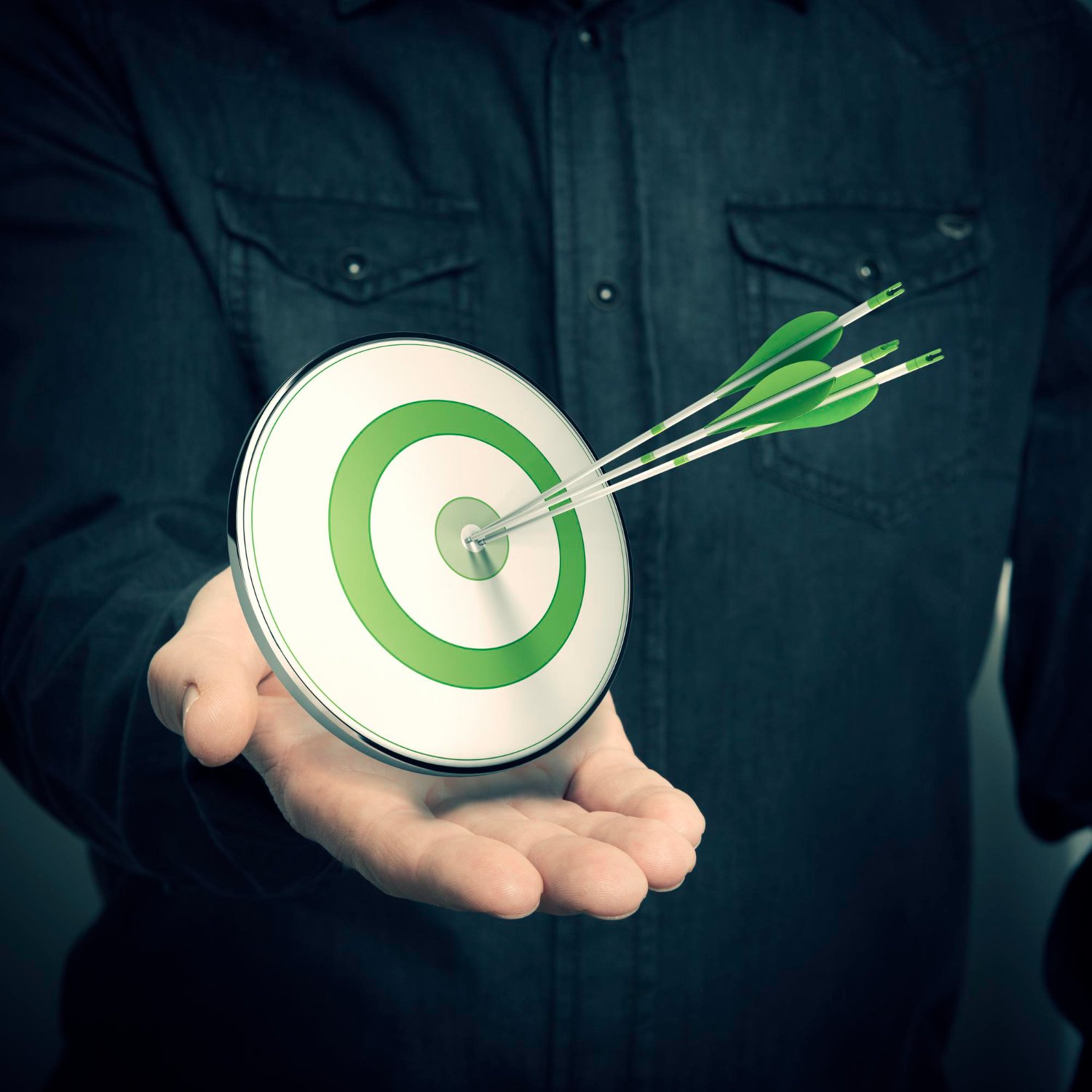one-hand-with-green-target-three-arrows-symbol-marketing-solutions-successful-company-advertising-blur-effect